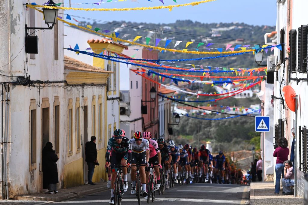 ALTO DO MALHO LOULE PORTUGAL FEBRUARY 18 A general view of Jordi Meeus of Belgium Nils Politt of Germany and Team Bora Hansgrohe and the peloton passing through a Paderne village during the 49th Volta ao Algarve em Bicicleta 2023 Stage 4 a 1779km stage from Albufeira to Alto do Malho Loule 514m VAlgarve2023 on February 18 2023 in Alto do Malho Portugal Photo by Tim de WaeleGetty Images