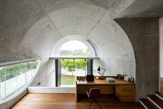 study under the concrete barrel vaulted roof at Bewboc house in Malaysia