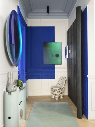 Color blocking in a hallway in various tones of blue