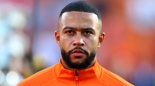 Memphis Depay of Netherlands stands for the national anthem prior to the UEFA Nations League League A Group 4 match between Netherlands and Poland at Stadium Feijenoord on June 11, 2022 in Rotterdam, Netherlands.