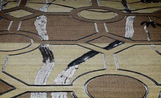 Close up of a brown cream and black rug