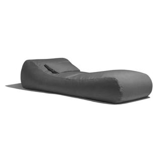 A grey large bean bag lounge chair with pillow