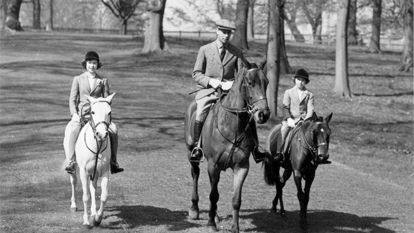 21st April 1939: Princess Elizabeth and Princess Margaret (1930 - 2002) riding along with their father, King George VI, on the future Queen's 13th birthday. (Photo by Topical Press Agency/Getty Images)