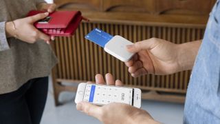 Person making credit card payment using Square Reader