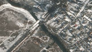 This close-up of the destroyed Irpin Bridge west of Kyiv, Ukraine shows the damaged bridge and lines of cars on one side.