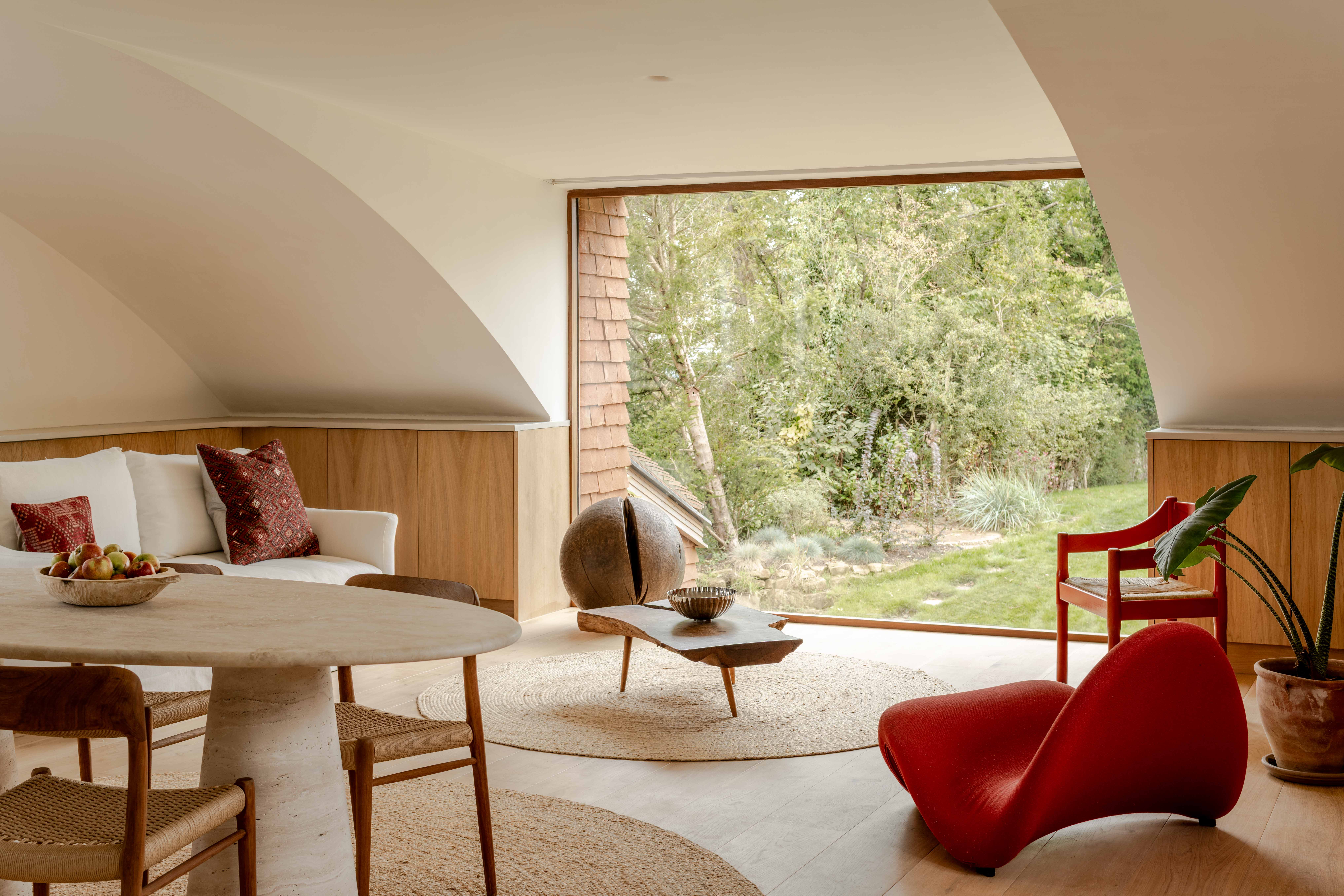 image of Clay Rise by Templeton Ford, a brick house with a curved roof in west sussex countryside