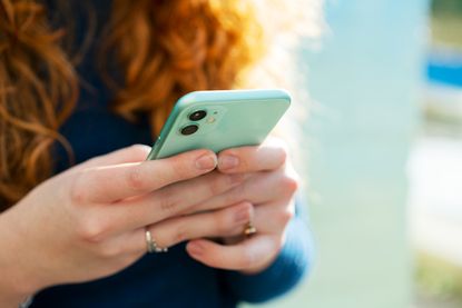 Close up of woman using smart phone