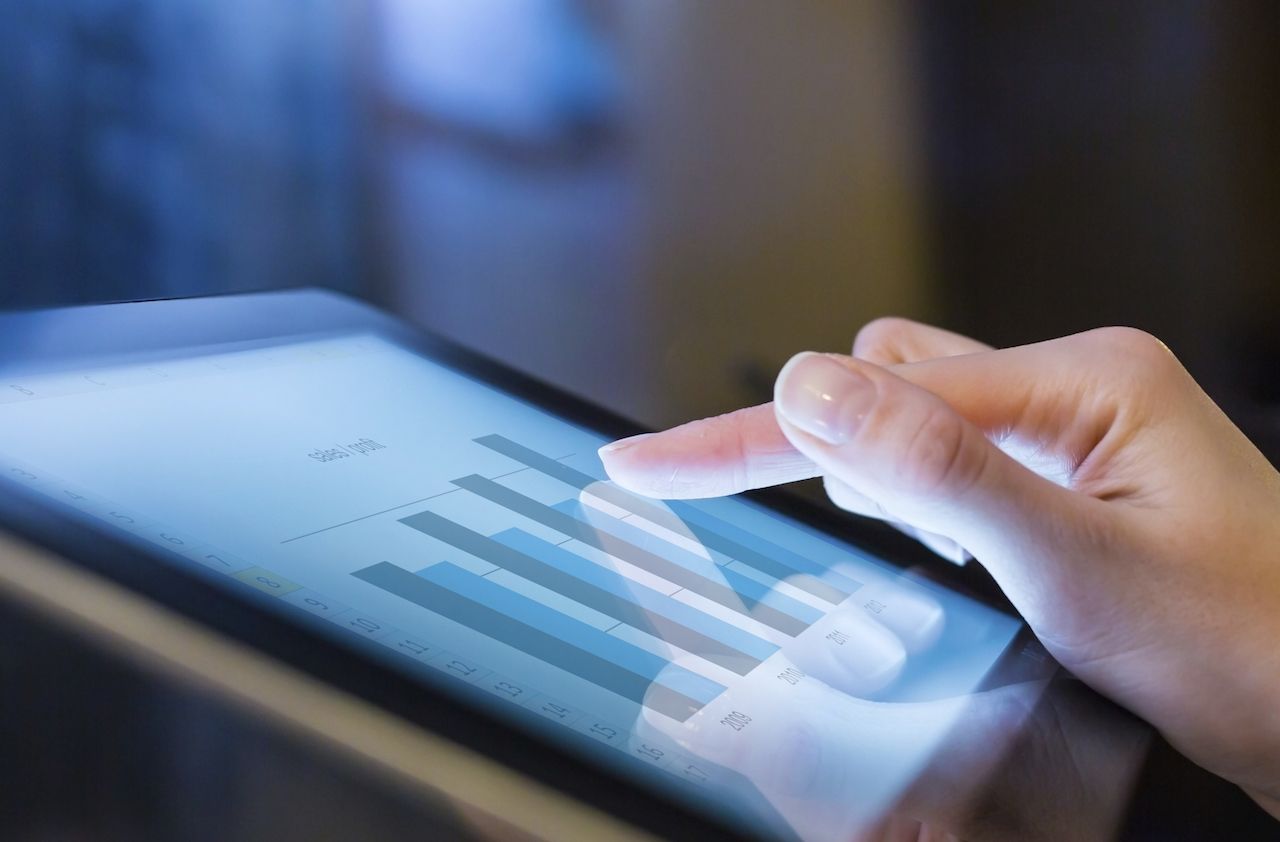 Woman holding digital tablet, closeup