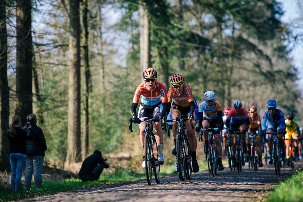 Chrisinte Majerus and Nikki Harris lead the way across the first cobbled section at Ronde van Drenthe