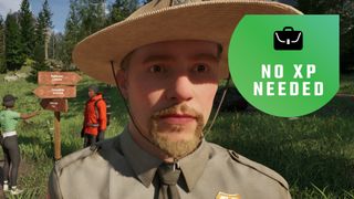A park ranger with people looking at a trail sign behind him