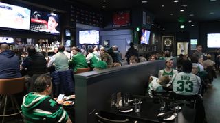 Scores sports bar is hopping with Boston fans watching a bevy of games. 