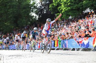 Paris, France - Women’s Road Race - Julia Kopecky (Czechia) waves at the crowds on the way up the Côte De La Butte Montmartre.