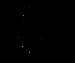 An image captured by the ASTERIA spacecraft, with the stars of Orion's belt in the lower left corner.