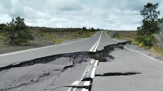 deep cracks in a road caused by an earthquake