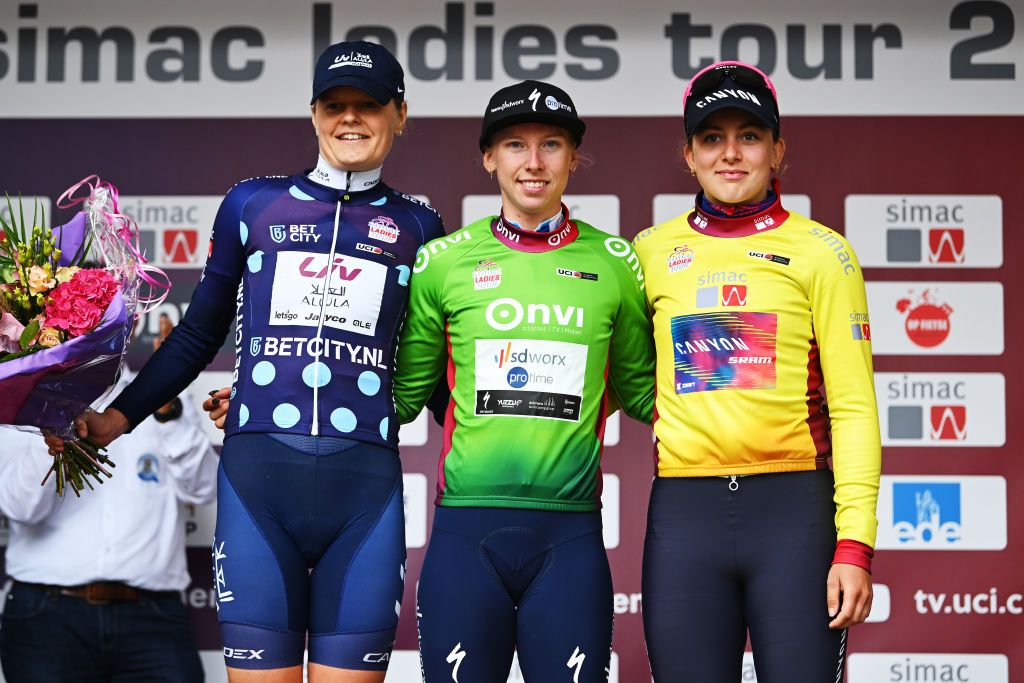 ZEEWOLDE NETHERLANDS OCTOBER 10 LR Jeanne Korevaar of The Netherlands and Team Liv AlUla Jayco Polka dot Mountain Jersey Lorena Wiebes of The Netherlands and Team SD Worx Protime Green points jersey and Zoe Backstedt of The United Kingdom and Team CanyonSRAM Racing Yellow leader jersey celebrate at podium during the 26th Simac Ladies Tour 2024 Stage 3 a 1484km stage from Zeewolde to Zeewolde UCIWWT on October 10 2024 in Zeewolde Netherlands Photo by Luc ClaessenGetty Images