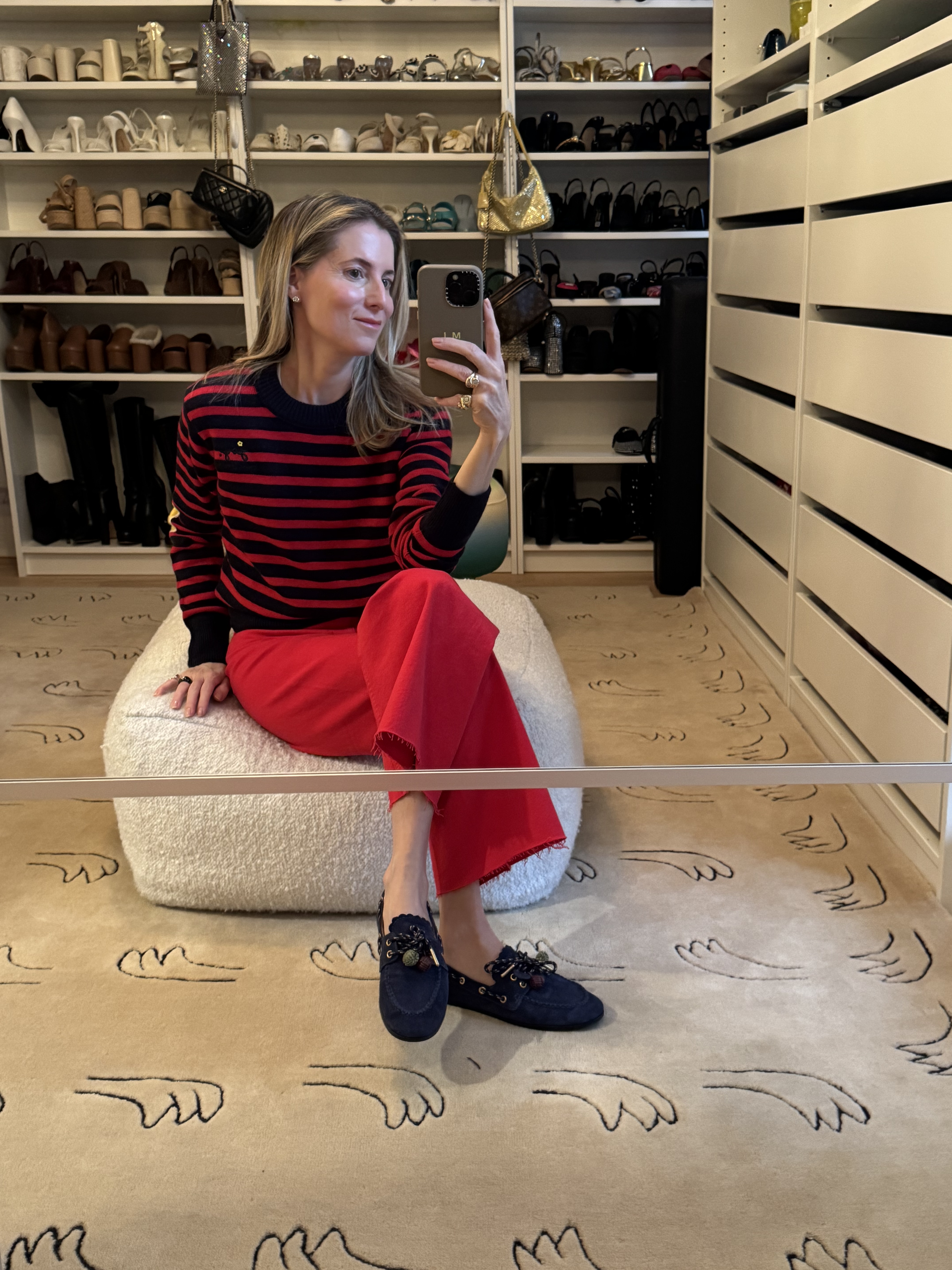marina larroud&amp;eacute; wearing striped sweater with red jeans and navy boat shoes