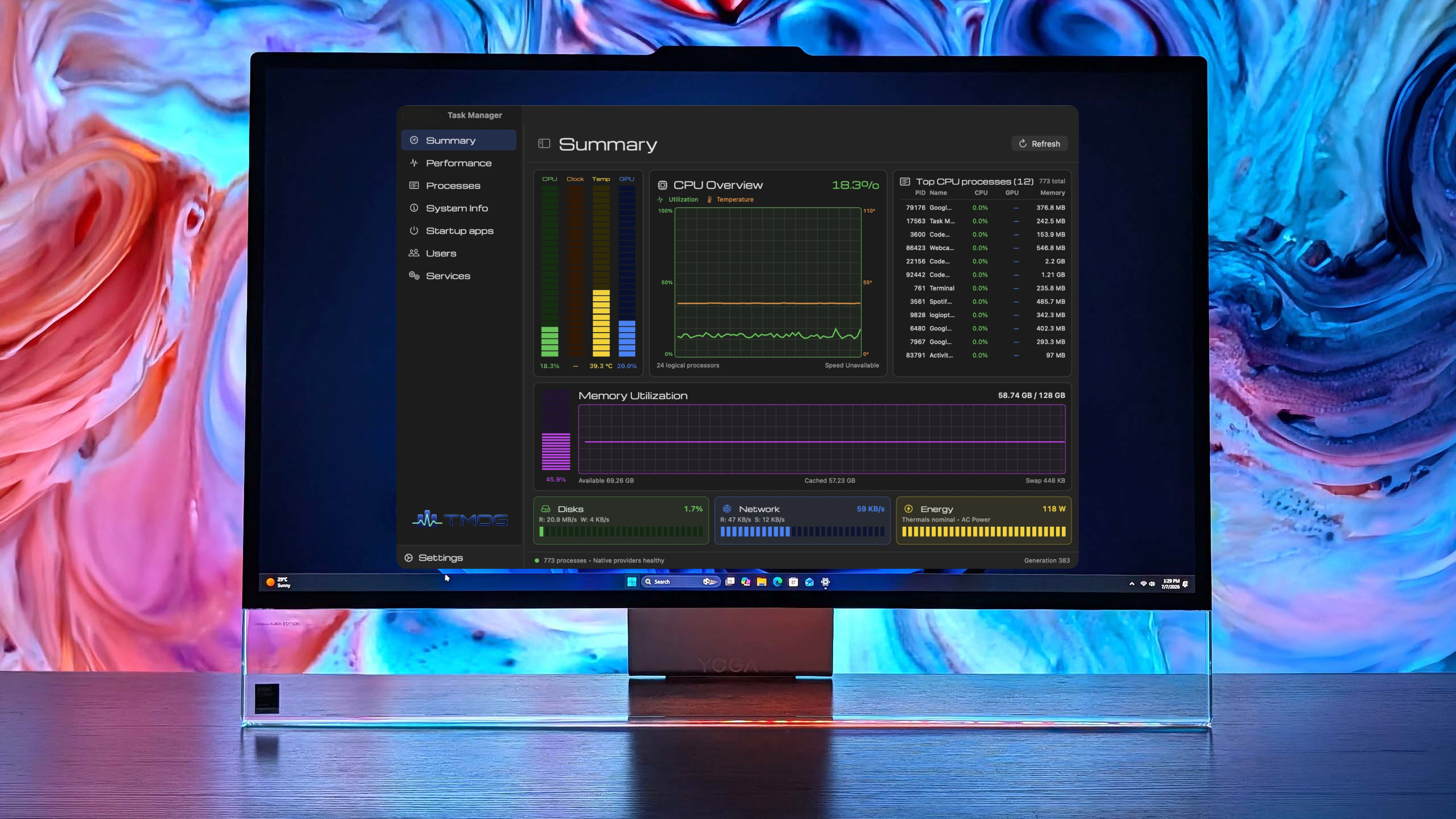 Lenovo PC displaying Task Manager OG with CPU and memory statistics, set against a colorful abstract background.