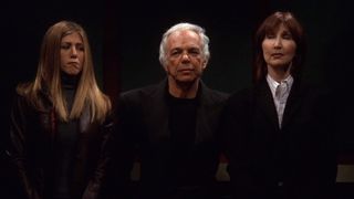 Ralph Lauren stands with his hands in his pockets in an elevator in his cameo on Friends