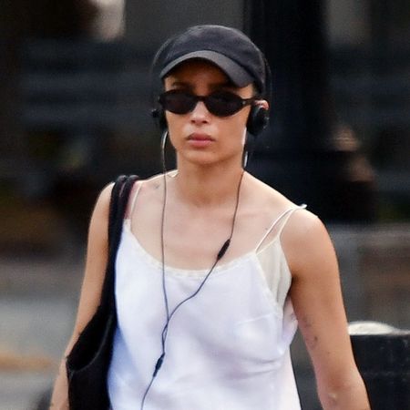 Zo&euml; Kravitz wearing a white mini slip dress with white socks and black loafers in New York City June 2024