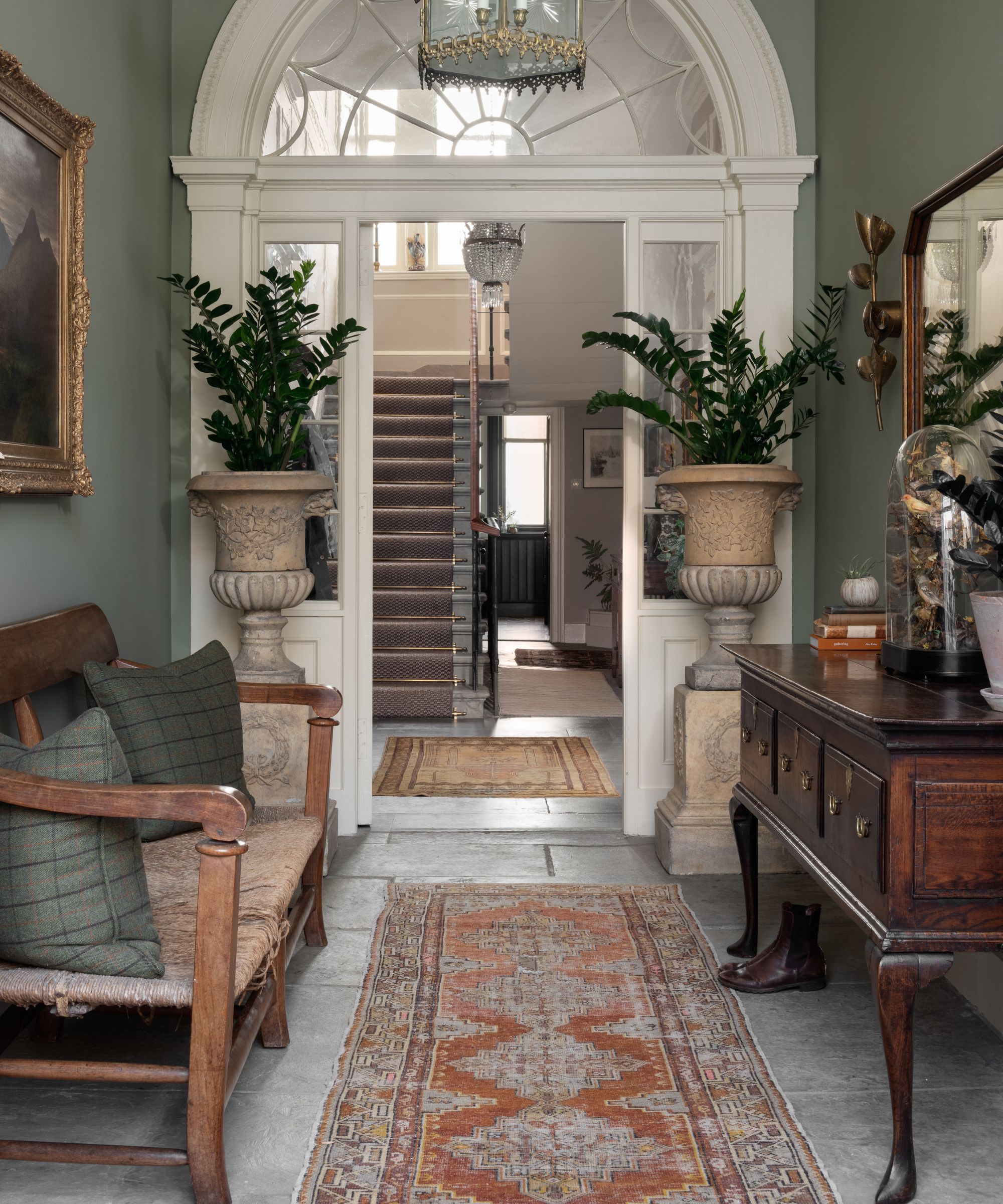 An hallway with a Persian rug on the floor.