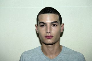 head shot of male model with short dark hair
