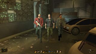 Three threatening gang members in a car park