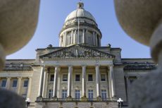 low camera angle of the capitol building in Kentucky against a blue sky