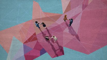 An illustration of businesspeople shaking hands, pictured from the top-down, against a pastel-colored landscape of geometric forms.