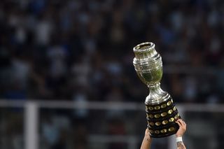 Lautaro Martinez of Argentina celebrates with the Copa America 2021 trophy after winning a match between Argentina and Colombia as part of FIFA World Cup Qatar 2022 Qualifiers at Mario Alberto Kempes Stadium on February 01, 2022 in Cordoba, Argentina. (Photo by Marcelo Endelli/Getty Images) Copa America 2024 squads