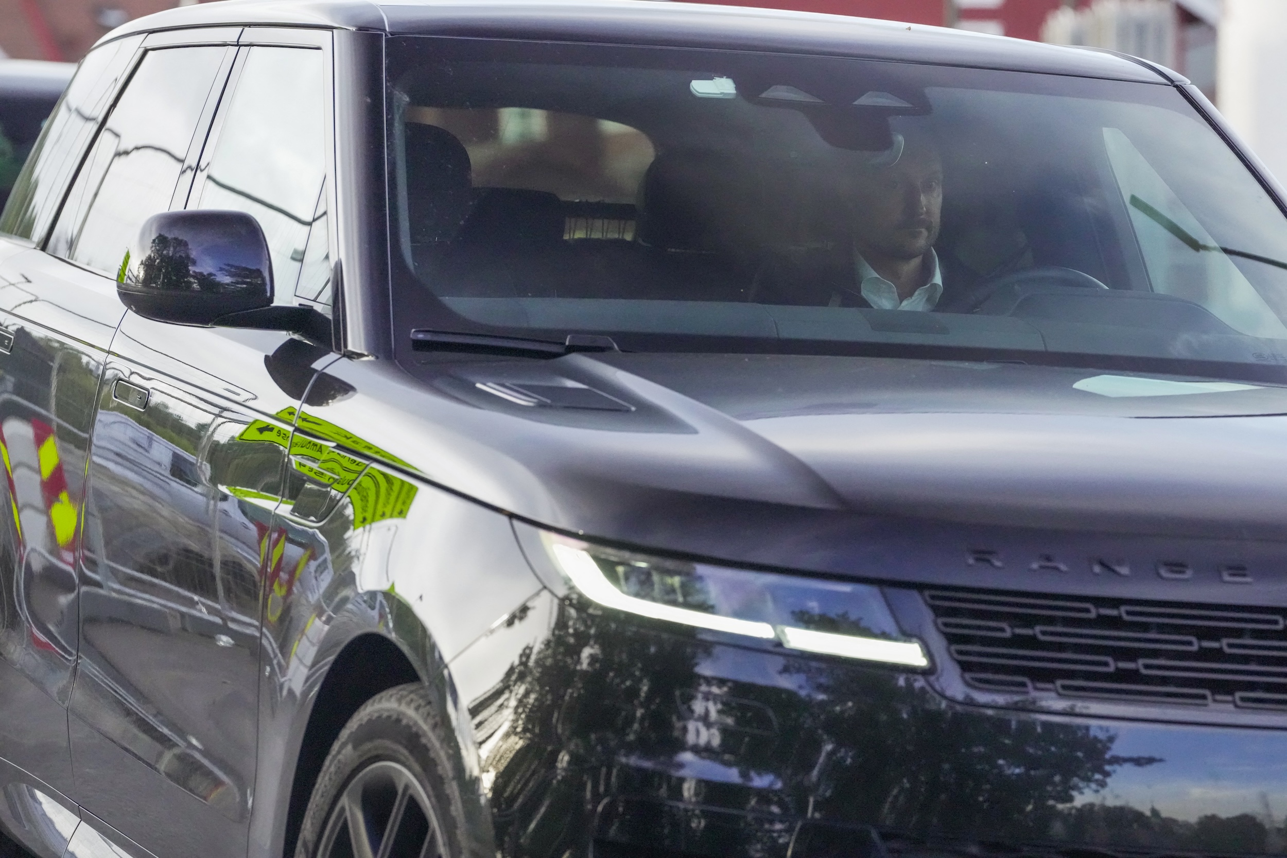 King Haakon driving a car