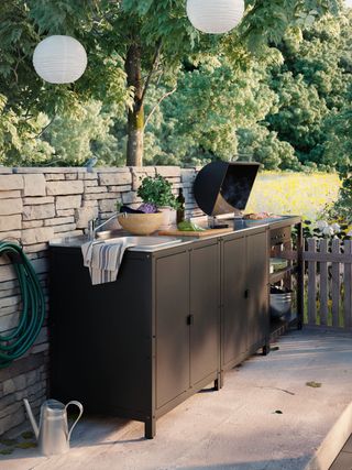outdoor kitchen with barbecue and sink