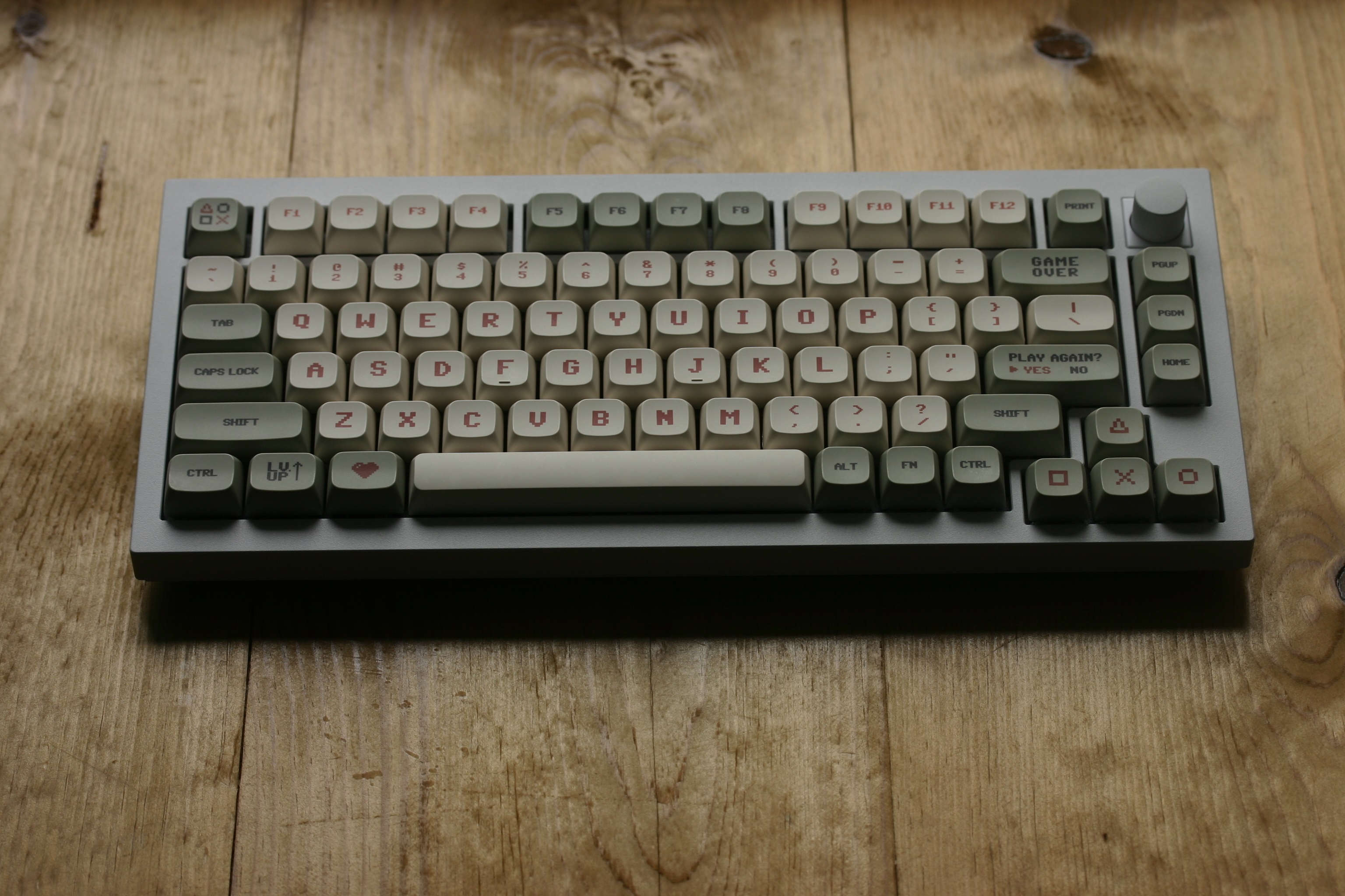 Small profile keyboard with retro-styled, beige and green keycaps