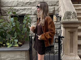 Robin Reetz in New York City wearing the corduroy trend with a brown suede jacket and loafers.