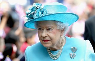 The Queen's aquamarine clips were a gift from her Father