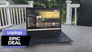Lenovo ThinkPad X1 Carbon Gen 11 outside on a wooden porch with greenage in the background