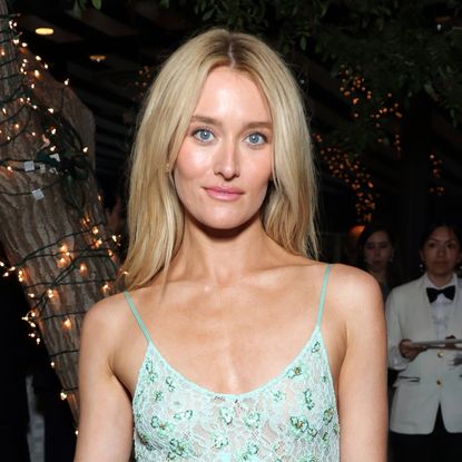 Sarah Pidgeon wears Chanel's take on the '90s slip dress trend, leaving behind Carolyn Bessette-Kennedy's color palette for light pistachio green