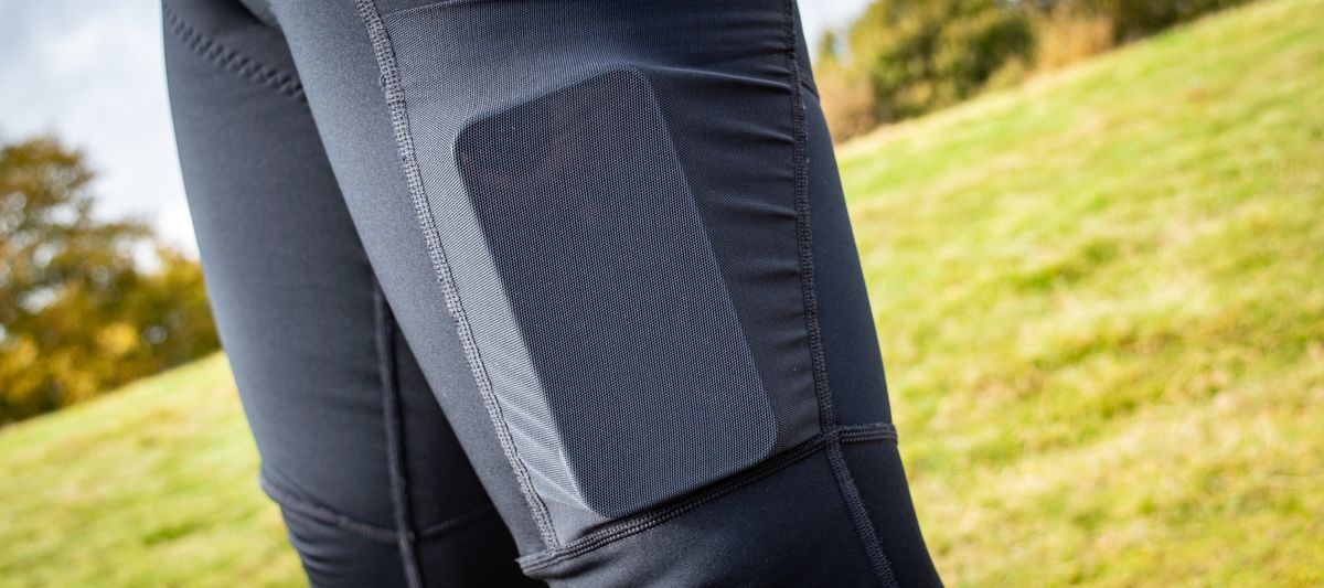 An iphone in the pocket of the POC Thermal Cargo bibtights