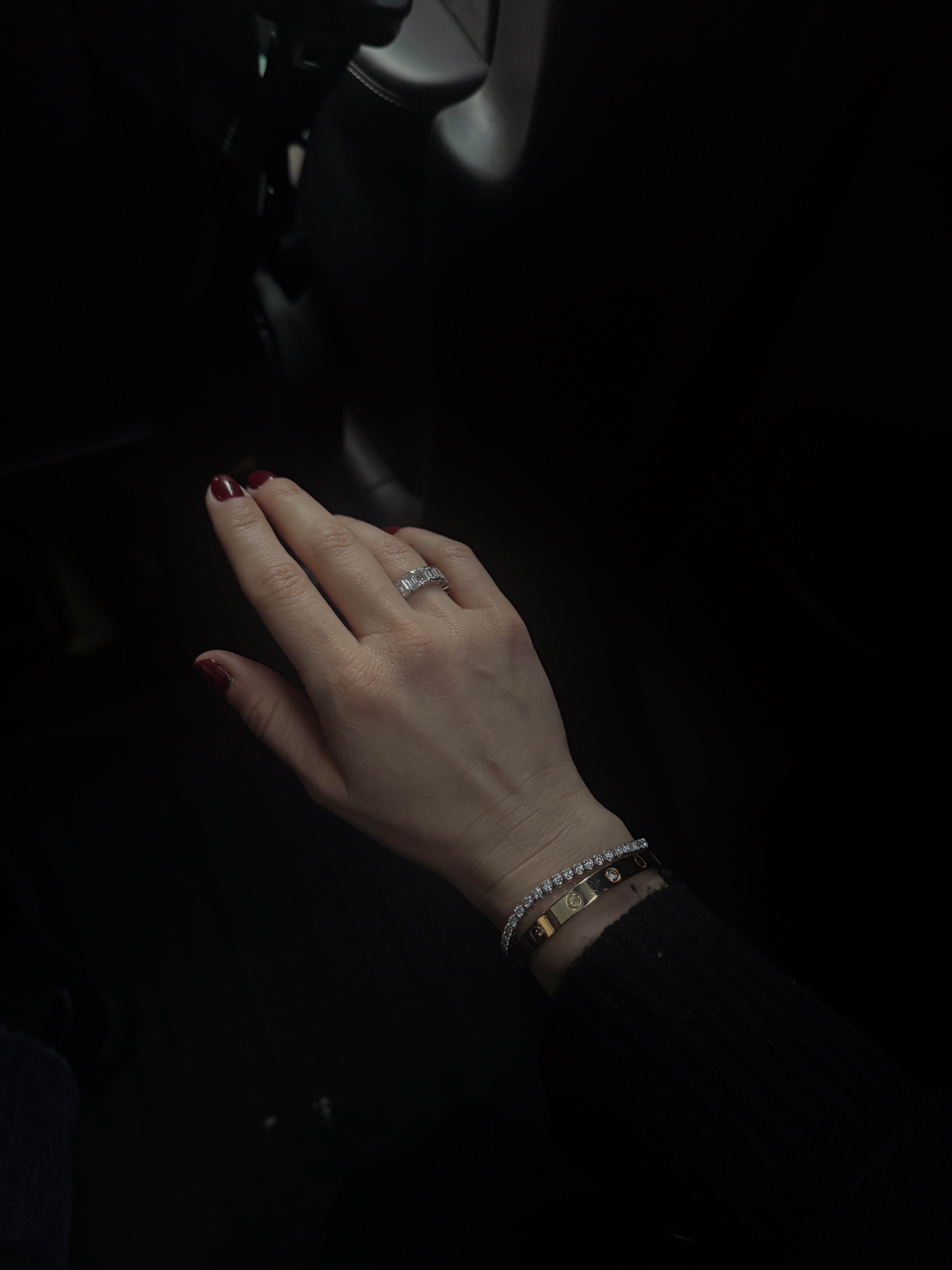 Kira Mackenzie Jackson wearing a diamond tennis bracelet and a diamond ring