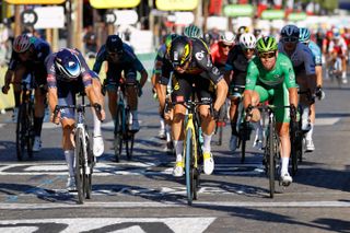 Wout van Aert wins the sprint on the Champs-Elysées at the 2021 Tour de France ahead of Jasper Philipsen and Mark Cavendish
