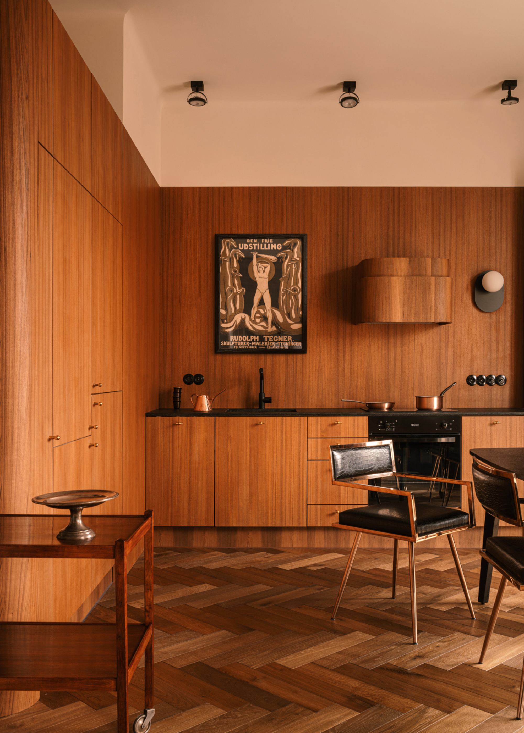 wood covered kitchen with full wooden walls and cabinets and flooring with a custom wooden extractor fan