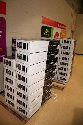 A stack of PS3 boxes for the waiting crowd outside.