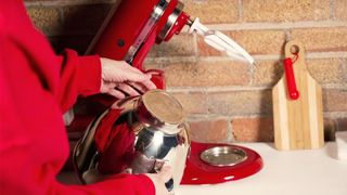 KitchenAid Artisan Tilt-Head stand mixer being tested by writer