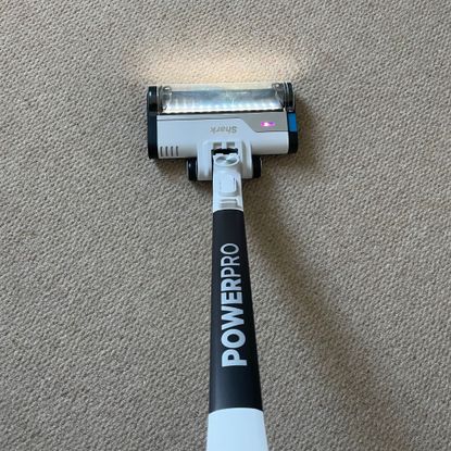 Shark PowerPro Pet Cordless Stick Vacuum on cream carpet