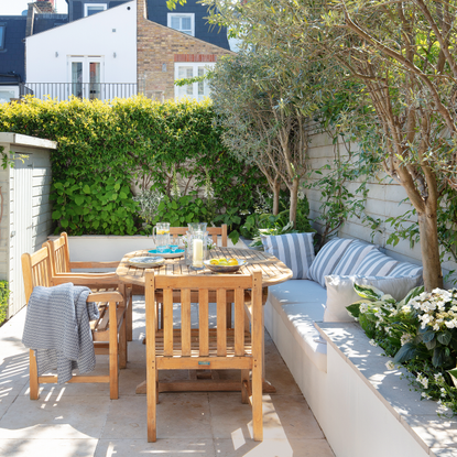 plan a small garden patio area with seating and shed