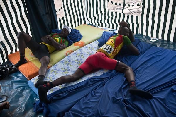 Augustin and Soglo rest in the tent camp before stage 6.