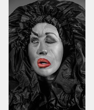 cindy sherman with distorted face and hood