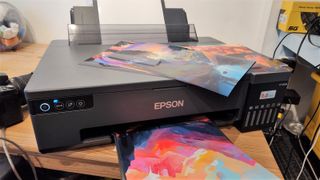 Epson EcoTank ET-18100 with print outs during our test