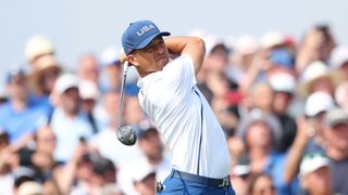 Xander Schauffele hits a fairway wood shot at the Olympics