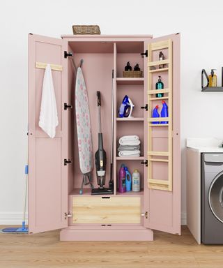 pink housekeepers cuboard with doors open showing contents