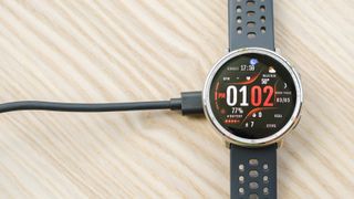 Close-up of the Amazfit Active 2 smartwatch on its charger